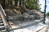  - The remains of the retaining wall  and the carved rock foundation of its extention  which were discovered in 1962 and were responsible for the diversion of the new Arditous st. allow us to know the extent of the temple site 